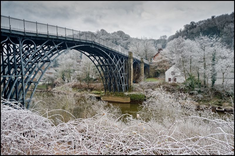 The world's first iron bridge was erected over the River Severn here in Shropshire in 1779. This pioneering single-span cast-iron structure was a turning point in British design and engineering; after it was built, cast iron came to be widely used in bridges, aqueducts and buildings.

Now Britain's best-known industrial monument, the bridge gave its name to the spectacular wooded gorge that was once an industrial powerhouse and the cradle of the Industrial Revolution. Ironbridge Gorge is now a World Heritage Site.
Ironbridge - Telford,Shropshire, TF8 7JP England.