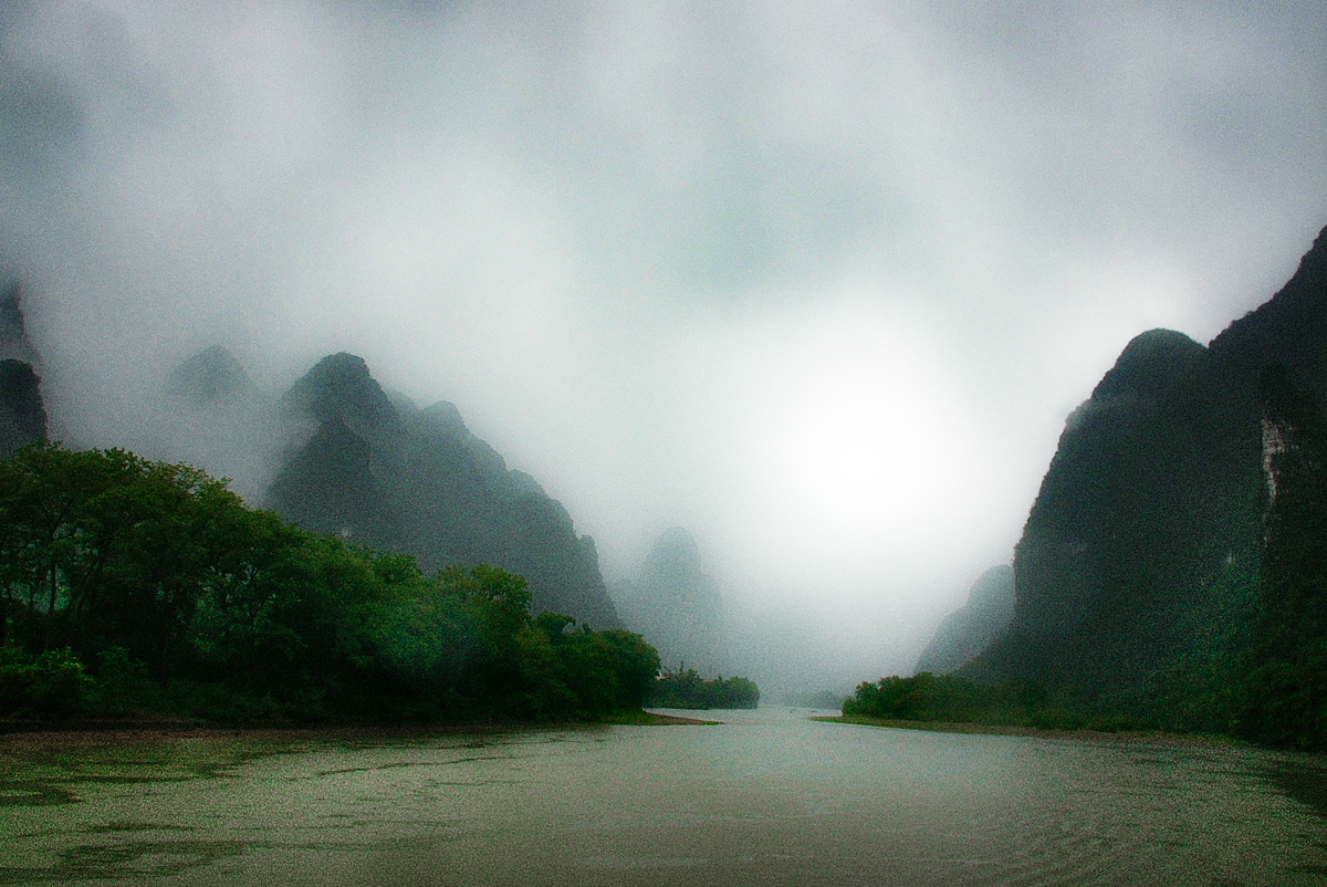 Li River, between Guilin and Yangshou on a rainy day, bad conditions for taking photographs but somehow this one came out nice, in my own opinion. The picture was taken with my Sony Alpha 700, and Sigma 18-200 zoom.