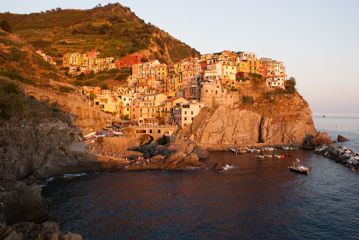 The sun sets after another hot day at Manarola in Italy.